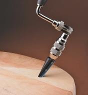 Veritas Pro Taper Reamer in a hand brace drilling into a chair seat