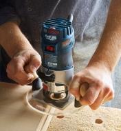 Using a router with compact router base plate and knobs attached