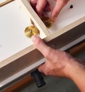Securing a Domino joiner in position on a Veritas Domino joinery table 