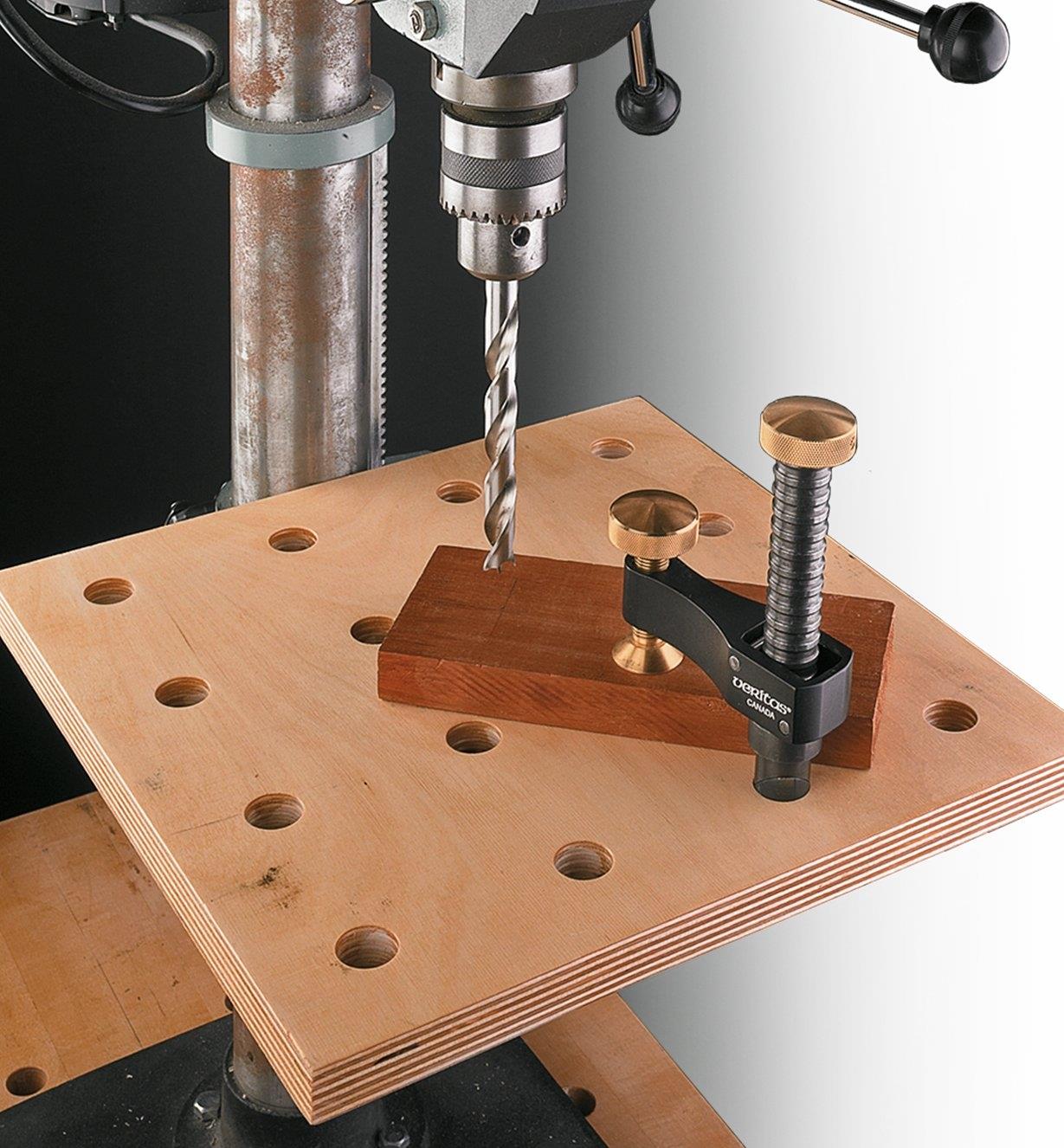 Veritas Surface Clamp holding a workpiece on a drill press table