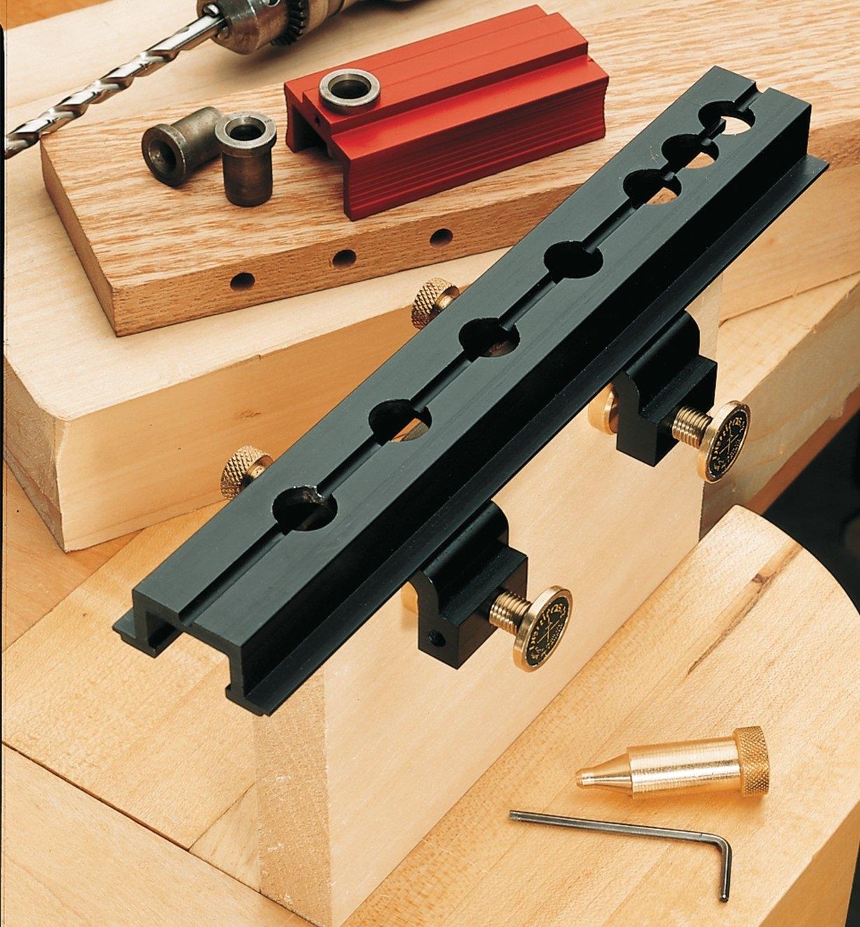 Dowelling jig attached to the end of a board prior to drilling holes