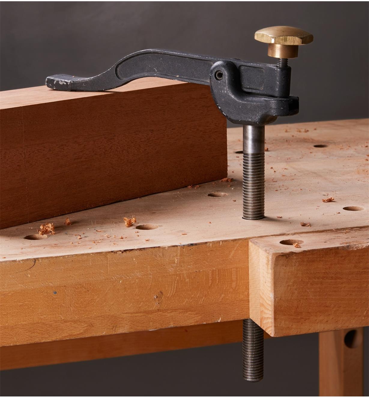 Veritas Hold-Down clamping a wood block on a workbench