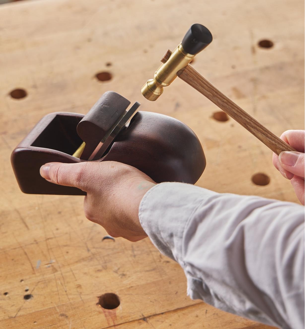 Adjusting the blade in a wooden plane using the Wile plane hammer
