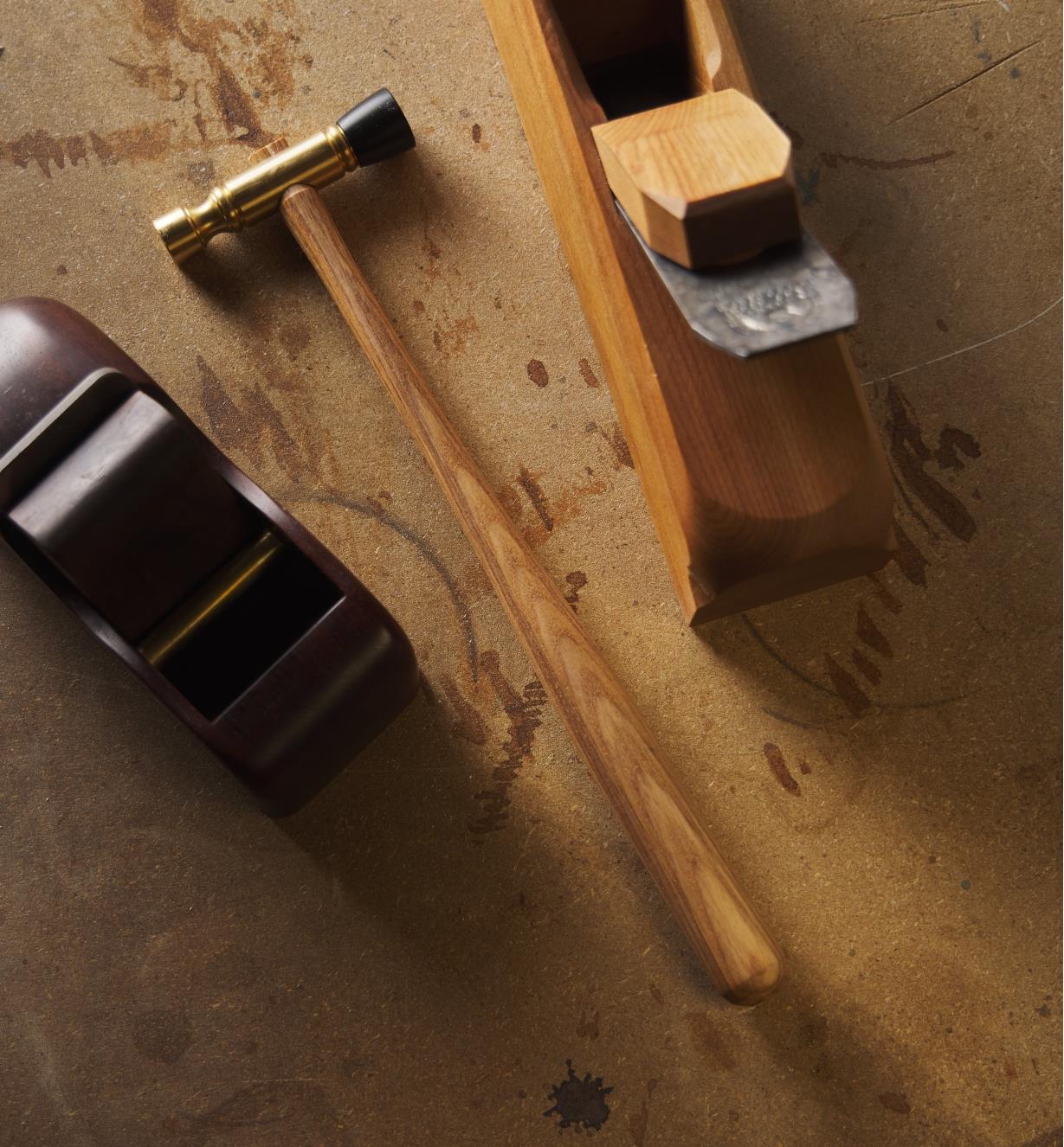 The Wile plane hammer and wooden planes on a work surface